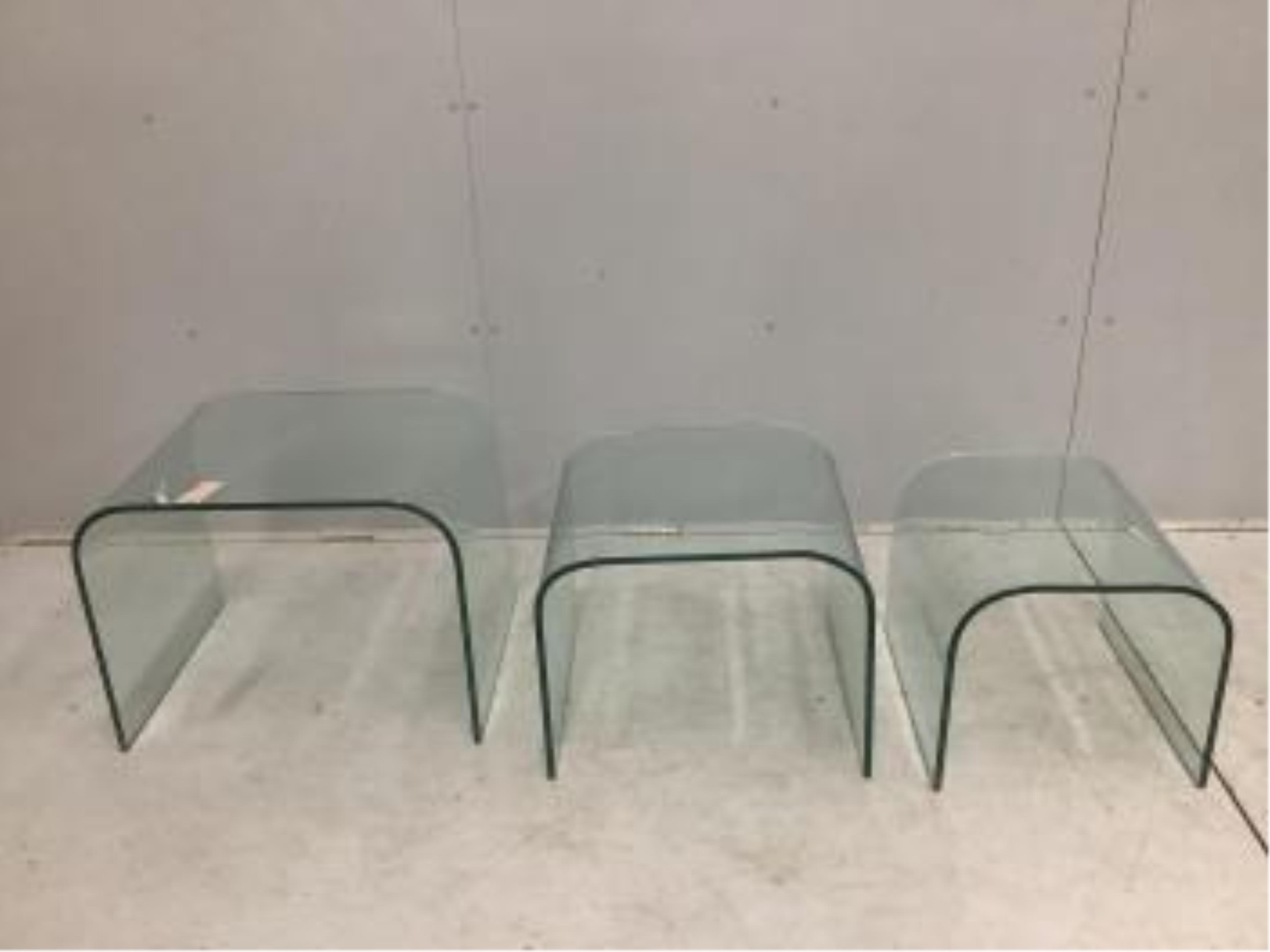 A nest of three Contemporary curved glass tables, width 59cm, depth 44cm, height 45cm. Condition - good